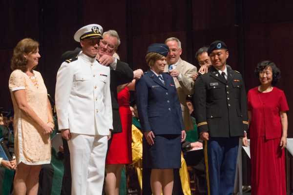 Dr. Peter Beale, Dr. Kristsen Eron, Dr. Yuxuan Mao are commissioned into the Navy, Air Force, and Army National Guard, respectively.