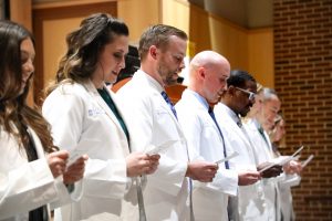 Incoming Physician Assistant Studies students recite the Hippocratic Oath at a white coat ceremony held in January 2020.