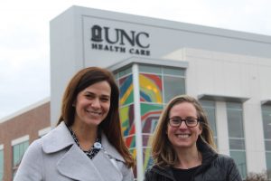 Claire West, MD, and Julia Tompkins, MSW, LCSW, outside the brand-new UNC Medicine Clinic at Panther Creek.