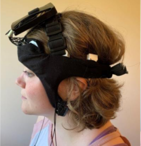 Device prototype, with electronics/battery on top. Next generation will incorporate electronics/battery into headband. 